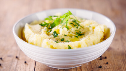 Bowl of Mashed Potatoes on Wooden Background – Creamy Comfort Food