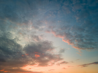The rays of the sun breaking through the dramatic clouds in the evening or in the morning in the sunset or sunrise sky.