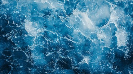 Obraz premium A close-up of turbulent blue water showcasing waves and bubbles, creating an immersive, dynamic texture.
