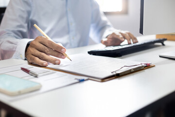 Close-up shot, asian businessman, professional lawyer working on computer meeting online with customer. checking business contract before providing legal advice at office