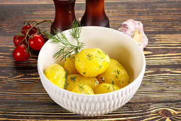 Boiled potato with oil and dill