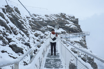 Grindelwald first, Switzerland Man on First Cliff Walk viewing platform on the First mountain in...