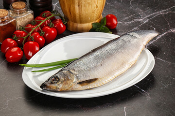 Whole raw salted herring fish