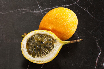 Yellow granadilla with cut half