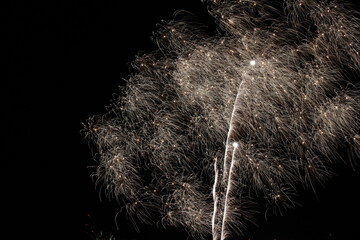 New Year's Eve firework in the dark sky | Series with colorful high contrast flares