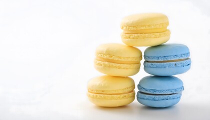 Fototapeta premium Yellow and Blue Macarons on White Background