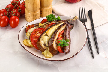Baked tomato with mozzarella and tomato