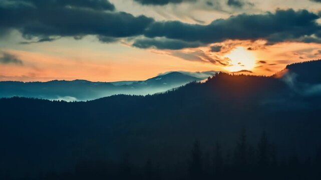 The setting sun is casting warm light and long shadows over the peaks and valleys of the carpathian mountains, creating a serene and awe-inspiring scene