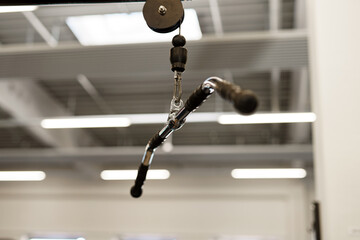 A traction attachment for a training block in a gym for fitness and bodybuilding.