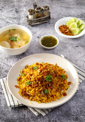 chicken biryani dish served on a table