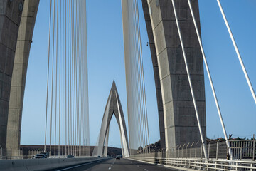 Detail of the Mohamed VI cable-stayed bridge over the Bouregreg river, or oued Bouregreg. Perfect blue sky.