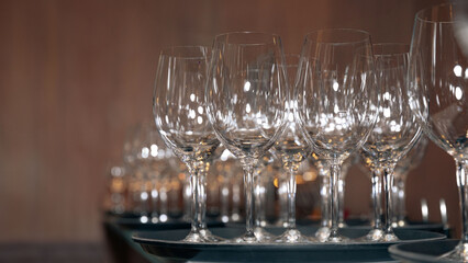 Elegant wine glasses set up in a line, ready for a celebration, beverage concept