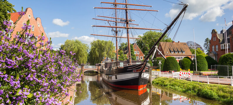 Panorama of purple flowers in front of the sailing ship in Papenburg, Germany