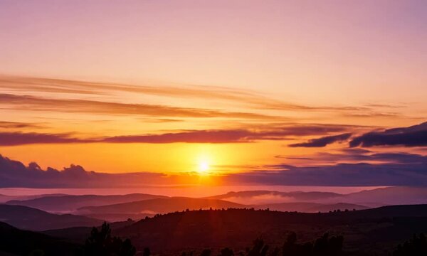 the sun sets behind the clouds over Simi Valley, Southern California.