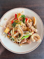 Cuisine Thailand style on top view. spicy papaya with black crab Thailand called farmer crab and fresh shrimp that is famous of Thailand Steer food. Select and soft focus.