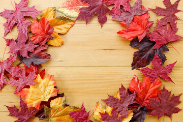 Background of autumn composition. Autumn leaves on wooden table.