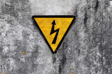 High voltage warning sign on concrete wall