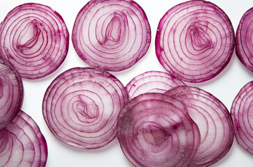Obraz premium Close-up of sliced red onion highlighting the vibrant pink and purple hues