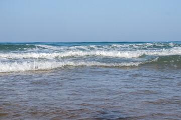 Waves breaking against the beach in Sancti Petri, Cadiz province, Spain