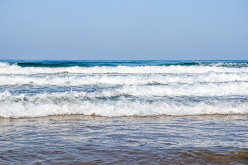 Waves breaking against the beach in Sancti Petri, Cadiz province, Spain