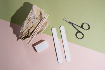 Manicure and pedicure tools composition, flat lay. Nail polish, file, scissors. Professional nail...