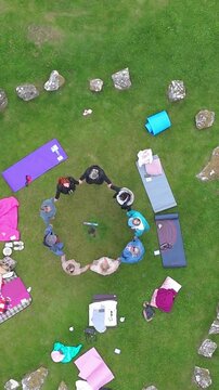 Aerial view of a group of women worshipping at the Beaghmore Stone circles at Blackrock Road by Cookstown in County Tyrone, Northern Ireland