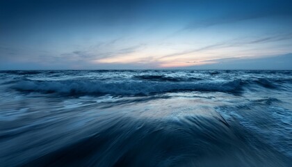 Calm ocean waves at twilight.