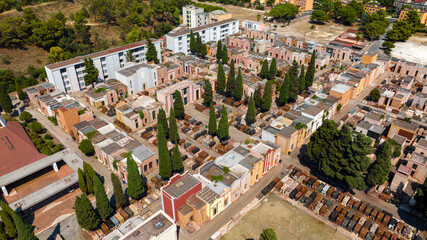 Fototapeta premium Aerial view of a Catholic Christian cemetery. There are many tombs and votive chapels.
