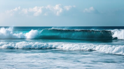Fototapeta premium A series of rolling waves in a turquoise ocean, creating a soothing and peaceful scene.