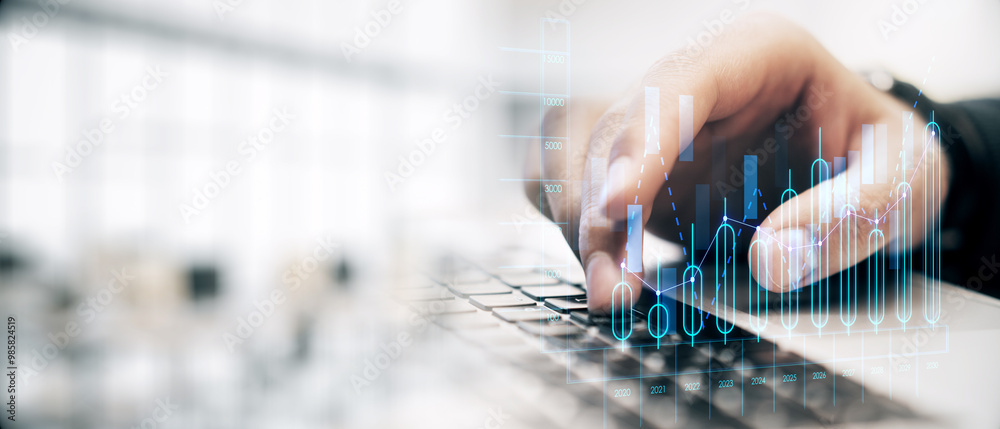 Poster businessperson typing on a laptop with financial graphs overlay on a light background, representing 