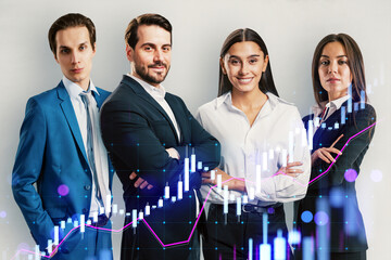Group of confident businesspeople standing with arms crossed, financial chart overlay on gray...