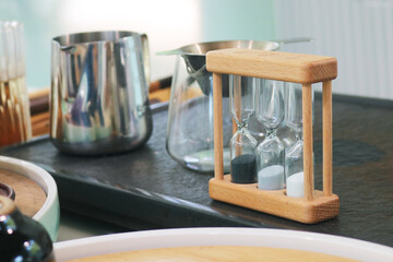 Vintage wooden hourglass one, three, five minute timer.