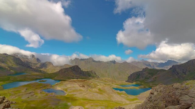 Nature timelapse footage. Motion of the clouds over the lakes on the top of the mountains.