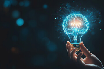 Hand holding glowing lightbulb with brain