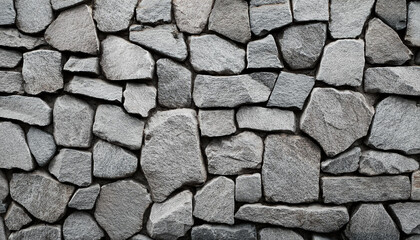 Granite stone wall, pattern of natural gray granite stone wall for background.