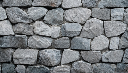 Obraz premium Granite stone wall, pattern of natural gray granite stone wall for background.