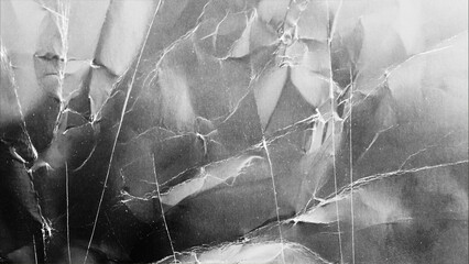 black cardboard texture with scuffs and scratches, wrinkled