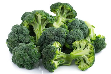 A pile of fresh broccoli on a white surface, ready to be used in various dishes
