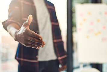Fototapeta premium Handshake, closeup and hands of business person in office for greeting, welcome and thank you. Professional, startup and worker with gesture for teamwork, collaboration and partnership for agreement
