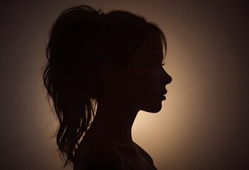 Silhouette of a beautiful girl light background