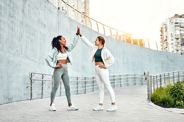 Motivation, daytime training in the city. Great run, woman's friends celebrate the end of the...