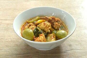 spicy boiled chicken with mixed vegetable in jungle curry soup Thai food in bowl