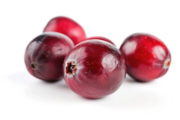 Obraz premium A cluster of bright red cranberries on a clean white background