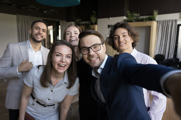 Excited joyful business group celebrating corporate success, high teamwork result, team achieve,...