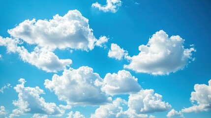 A clear blue sky with white, cotton-like clouds gently floating across, providing an open, airy backdrop for any design concept.