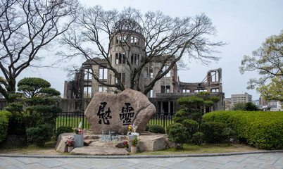 Hiroshima Peace memorial, Atomic Bomb Dome, Japan. Memorial offerings water bottles and flowers