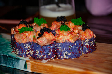 Vibrant sushi rolls platter. Fresh roll in bar restaurant. Colorful serving. Japanese sushi platter. Sushi advertising. Advertising of Japanese food. Sushi roll. Japanese cuisine. Japan