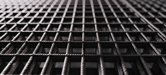 Naklejka premium Black steel bars on a grid