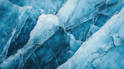 Close-up of the intricate textures of Mendenhall Glacier ice, highlighting the deep blue colors and the massive cracks within the glacier.