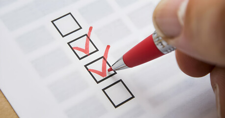 Red Check Mark on Checklist with Pen